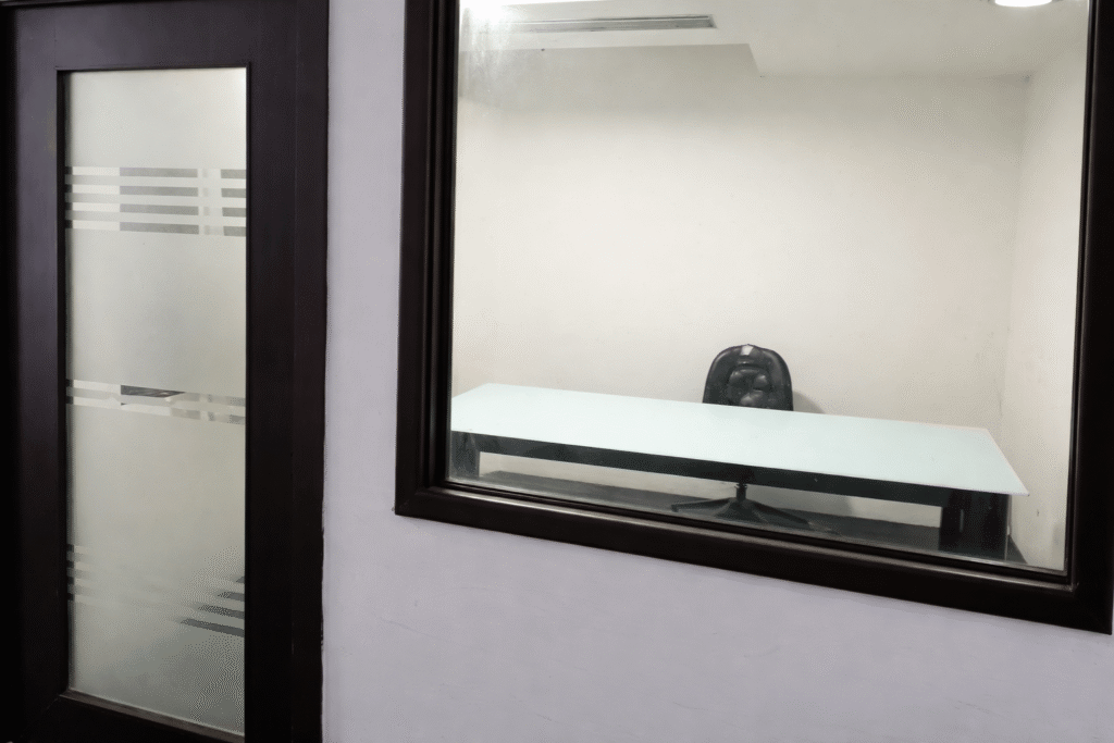 Glass-enclosed private cabin at Elite Co-Working Indore