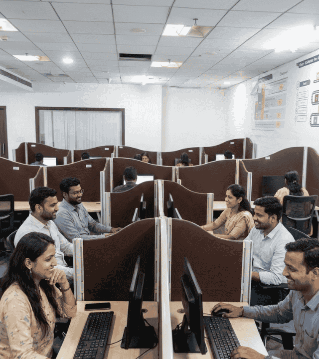 Professionals working at shared desks at Elite Co-Working Indore
