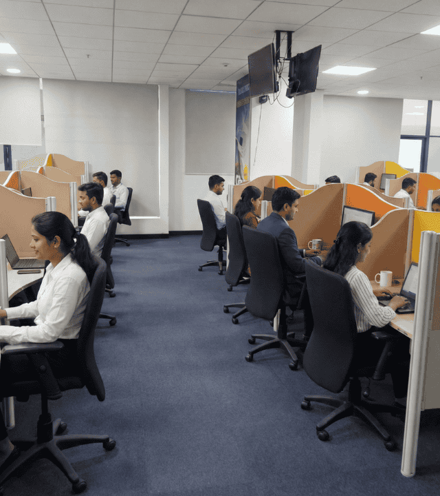 Open work floor at Elite Co-Working Indore with dedicated desks